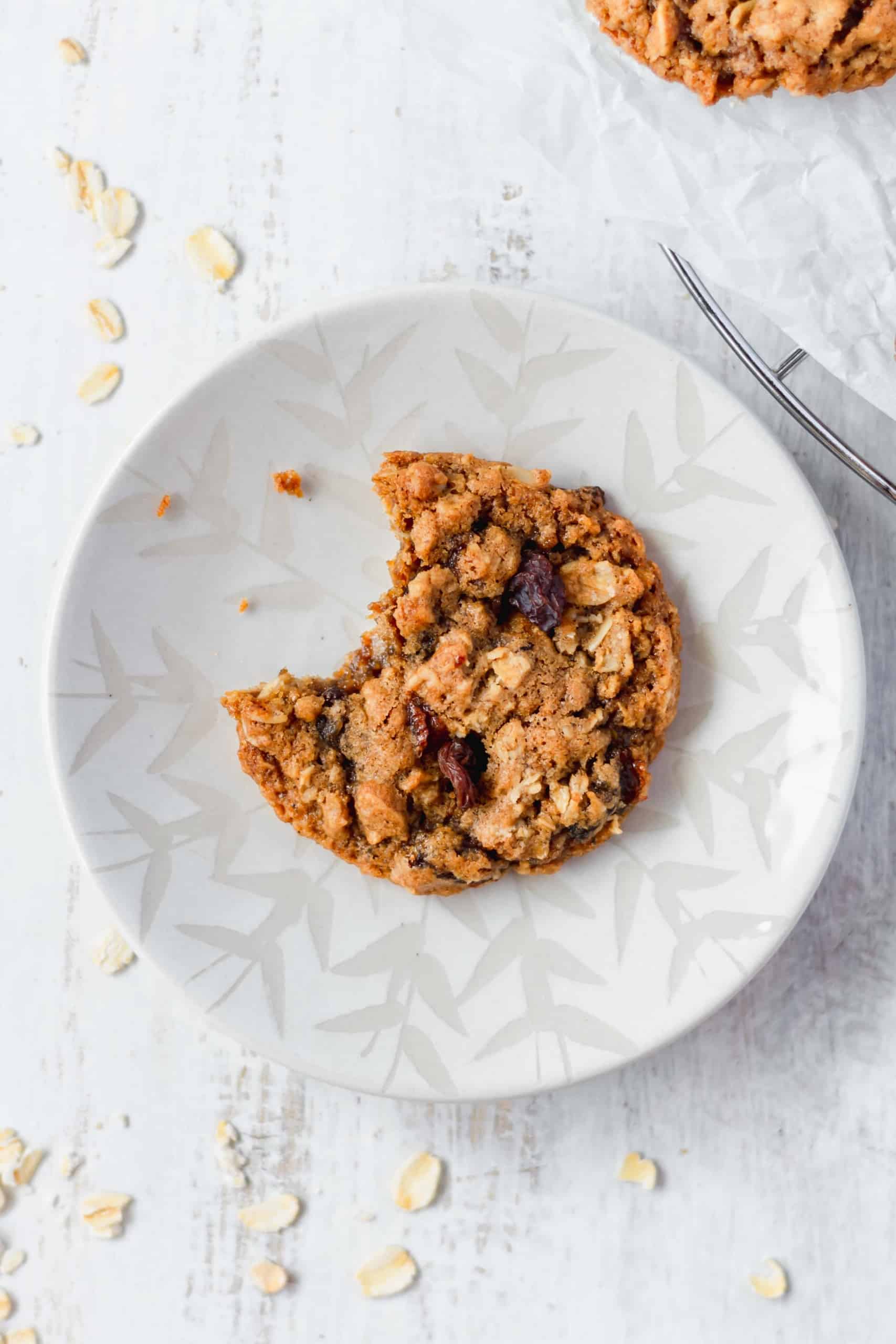 A bitten cookie on a plate
