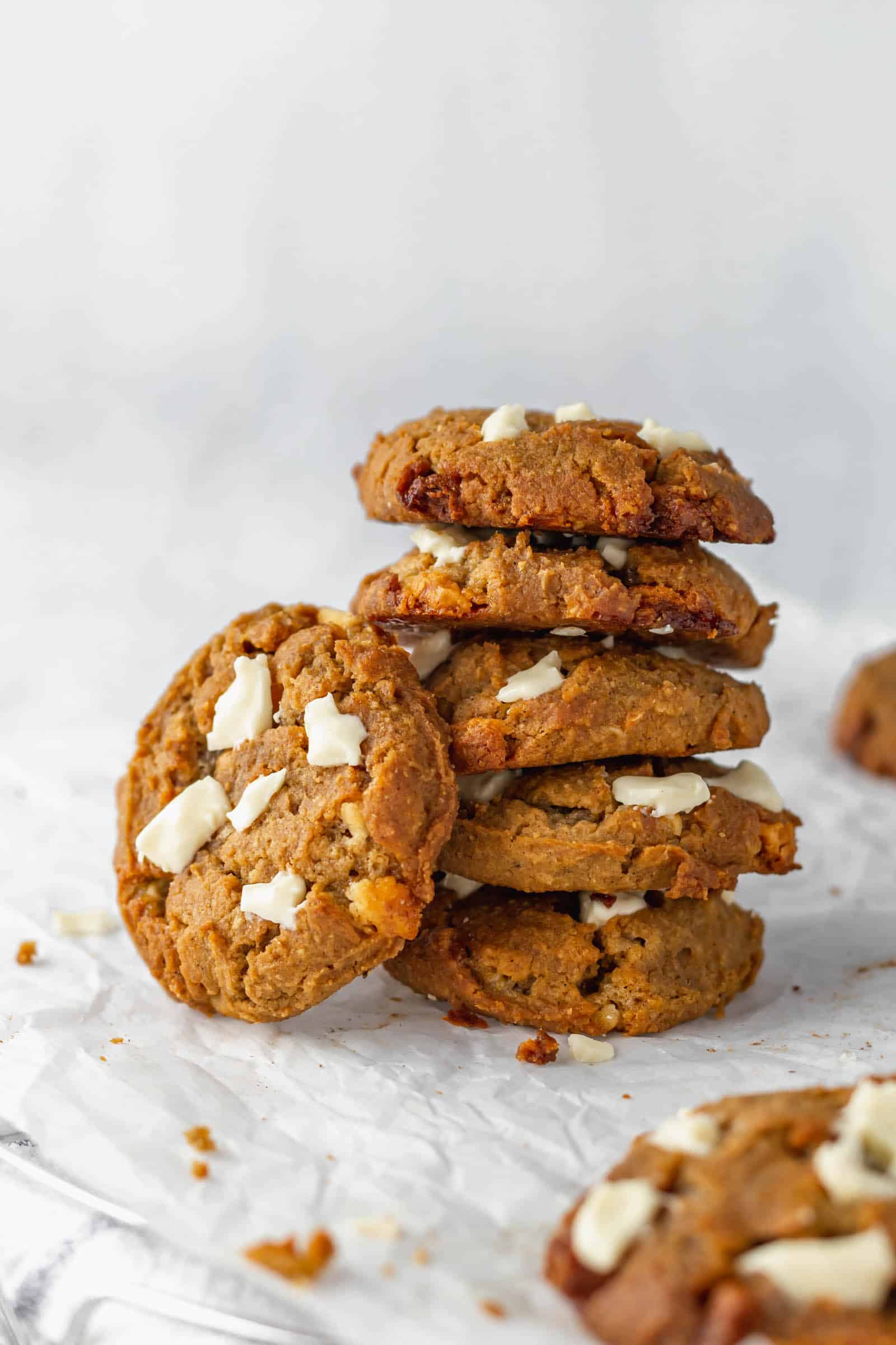 A stack of chai cookies on parchment paper.