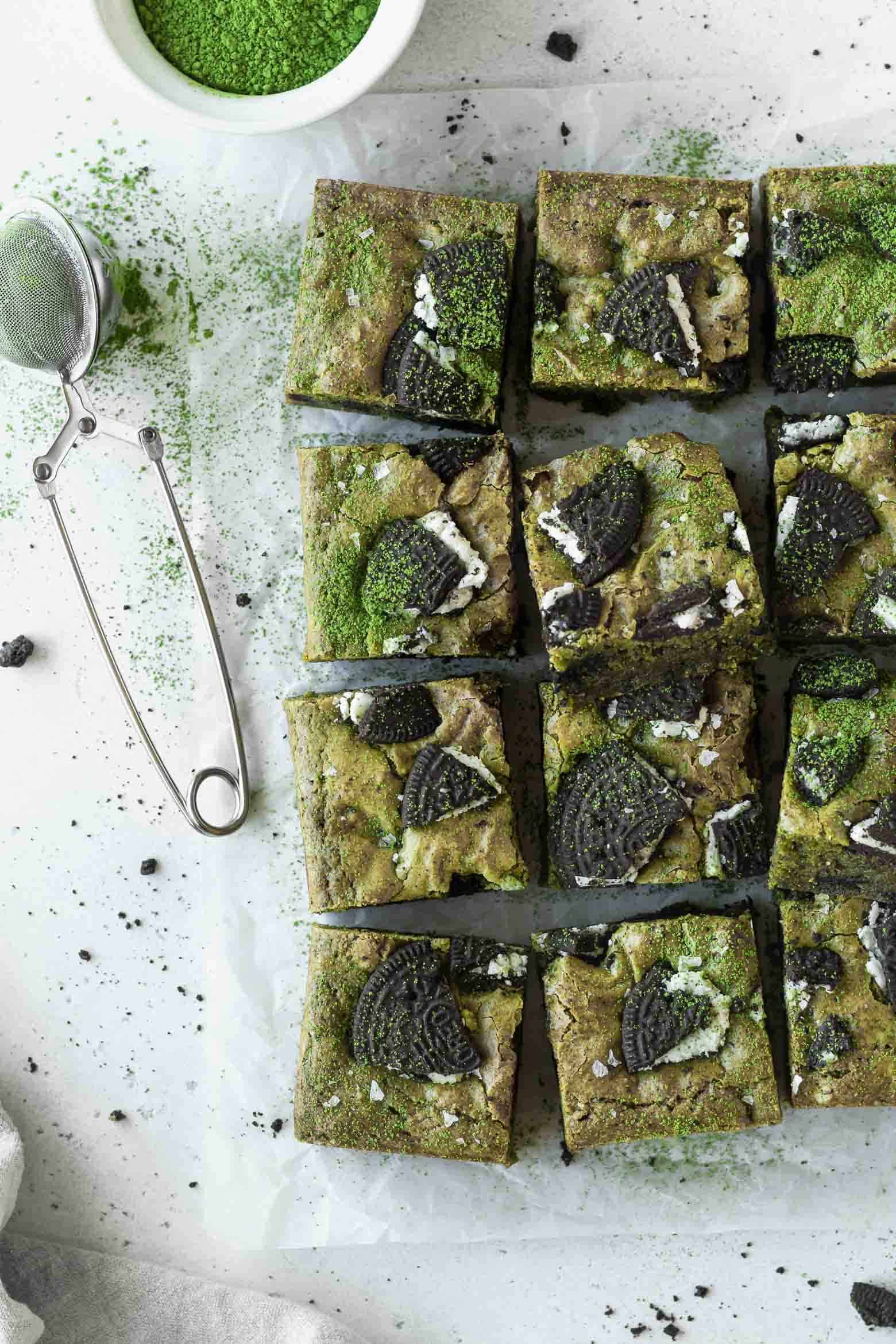 Squares of matcha blondies on a parchment paper