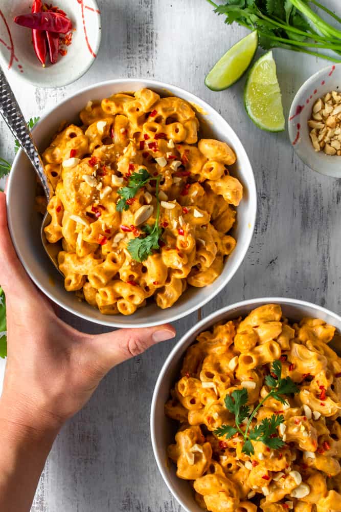 This vegan red curry mac and cheese is comfort food with a kick! The addition of Thai red curry paste and lime juice gives this creamy vegan mac and cheese a spicy tang! #thaicurry #redcurry #vegan #macandcheese #macncheese #vegancheese