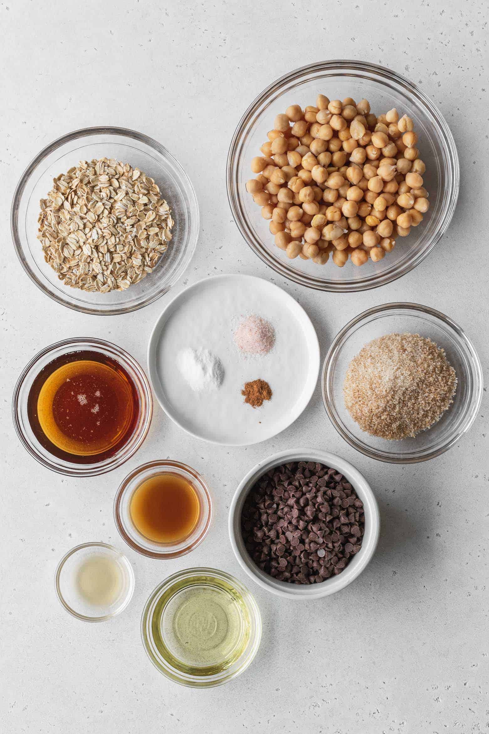 Ingredients for chocolate chip chickpea cookies measured out into bowls.
