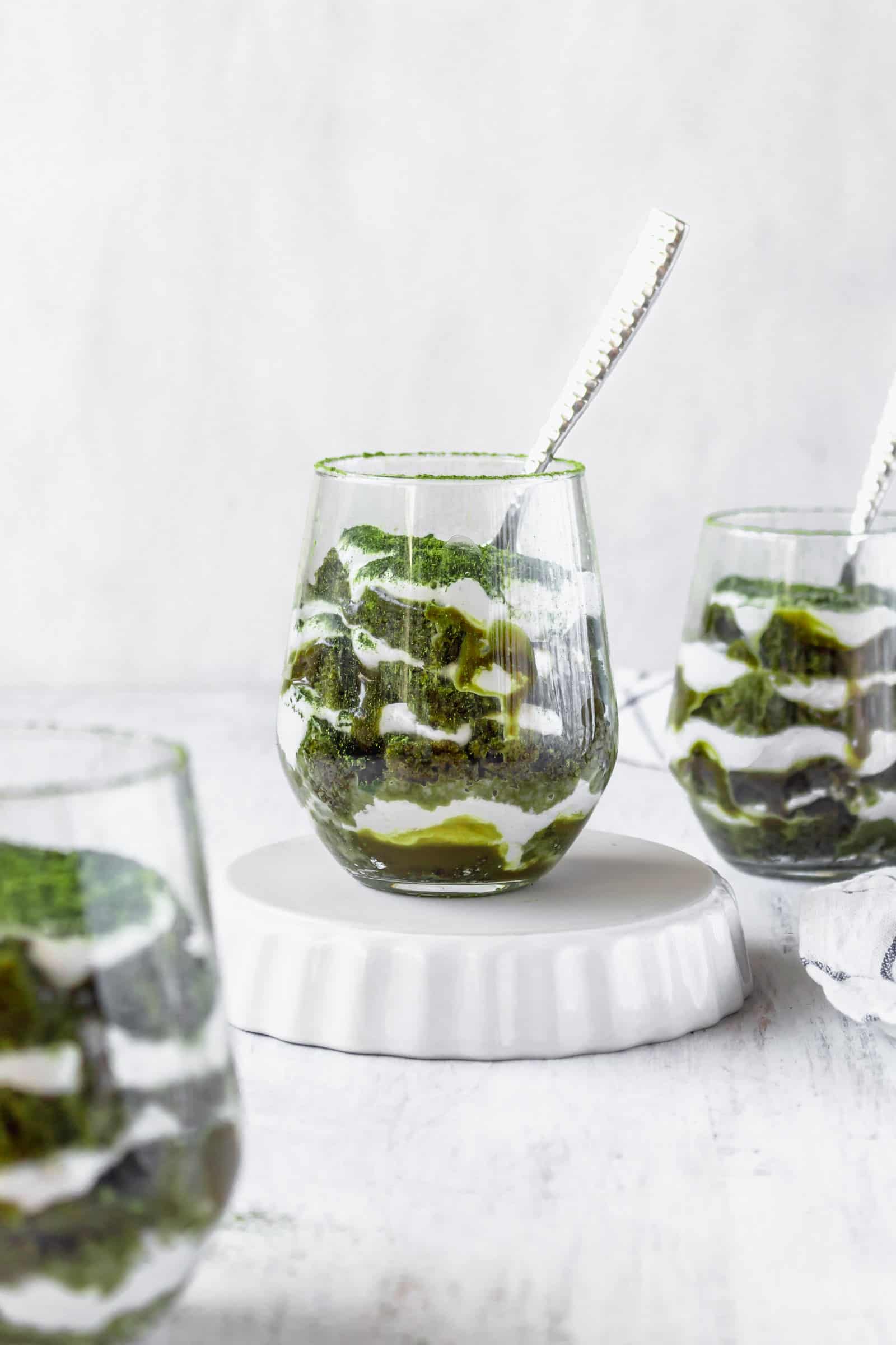 Vegan matcha tiramisu is a Japanese twist on a classic Italian dessert! This recipe has layers of matcha cake, matcha sauce, and coconut whipped cream! #matchadessert #vegantiramisu #matchatiramisu #vegandessert #coconutwhippedcream