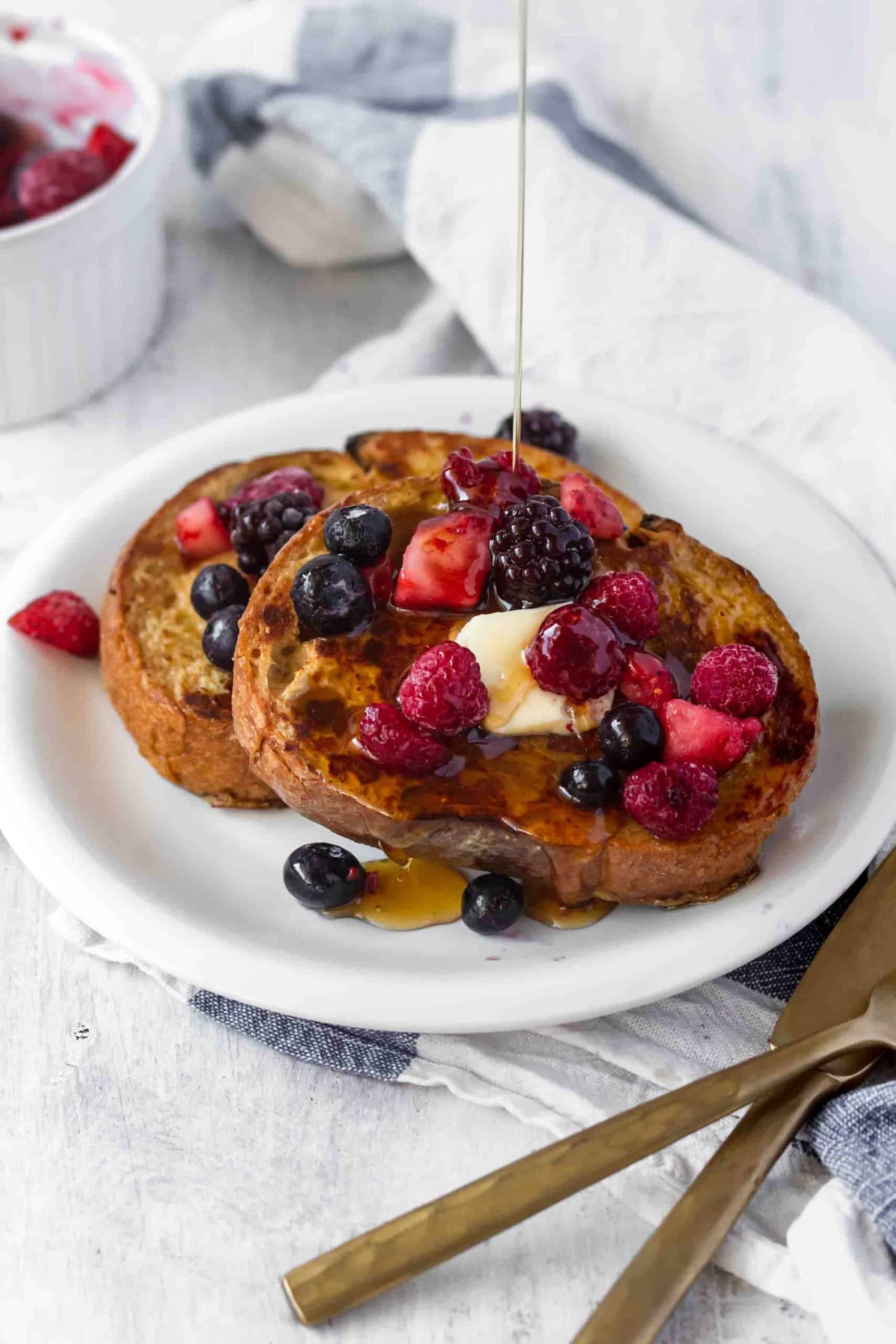 Vegan french toast is easy to make and shockingly delicious! Made with coconut milk and chickpea flour, it's perfect for breakfast or brunch! #veganfrenchtoast #veganbreakfast #veganbrunch #plantbasedmeals #frenchtoast