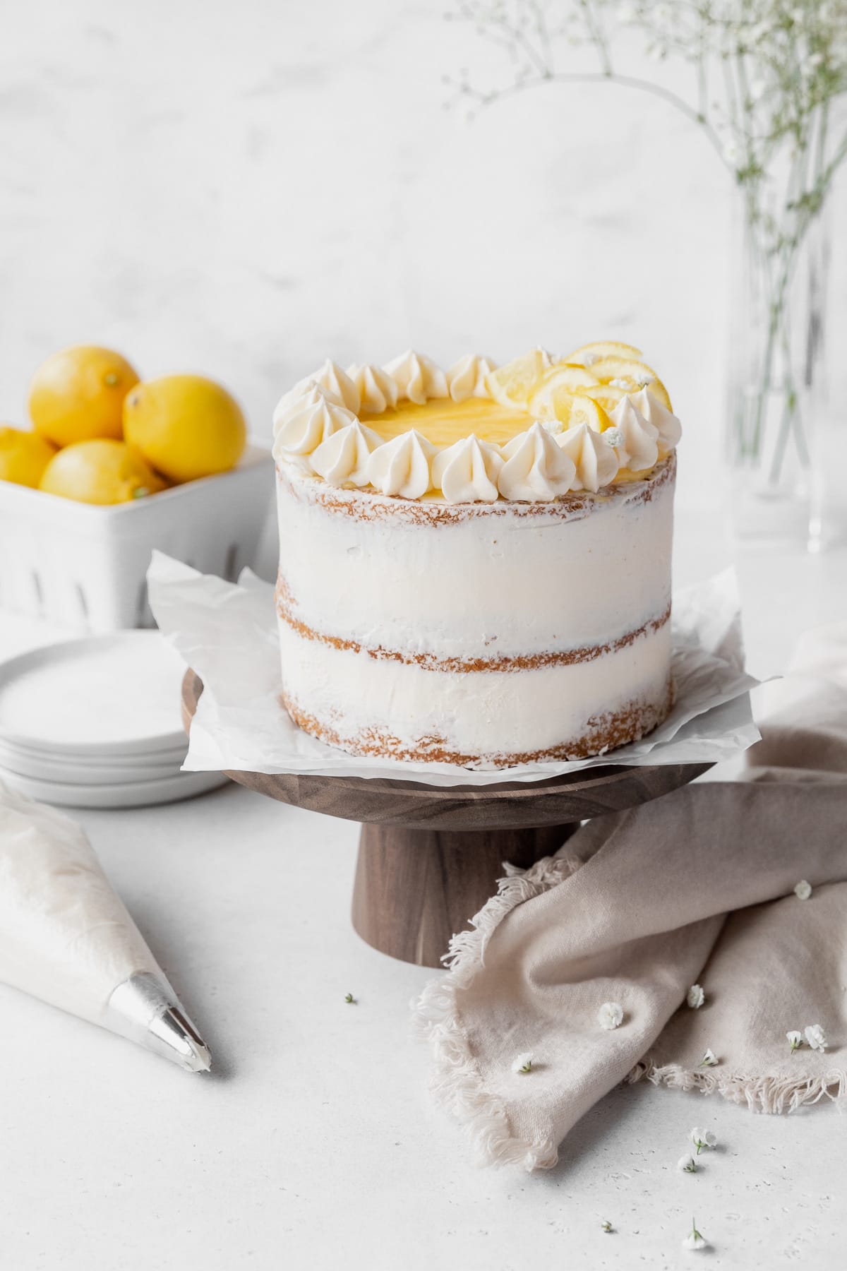Lemon birthday cake decorated with lemon curd and lemon buttercream.